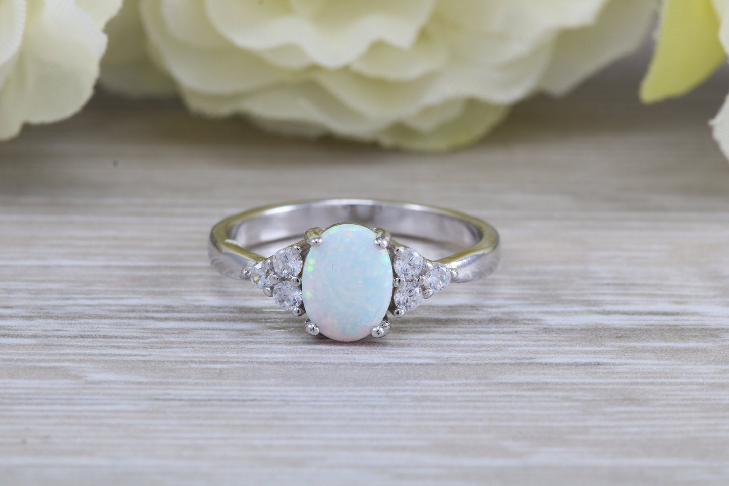 Very sparkly and fiery Opal and cubic zirconia set dress ring, solid sterling silver ring further rhodium plated for that platinum look