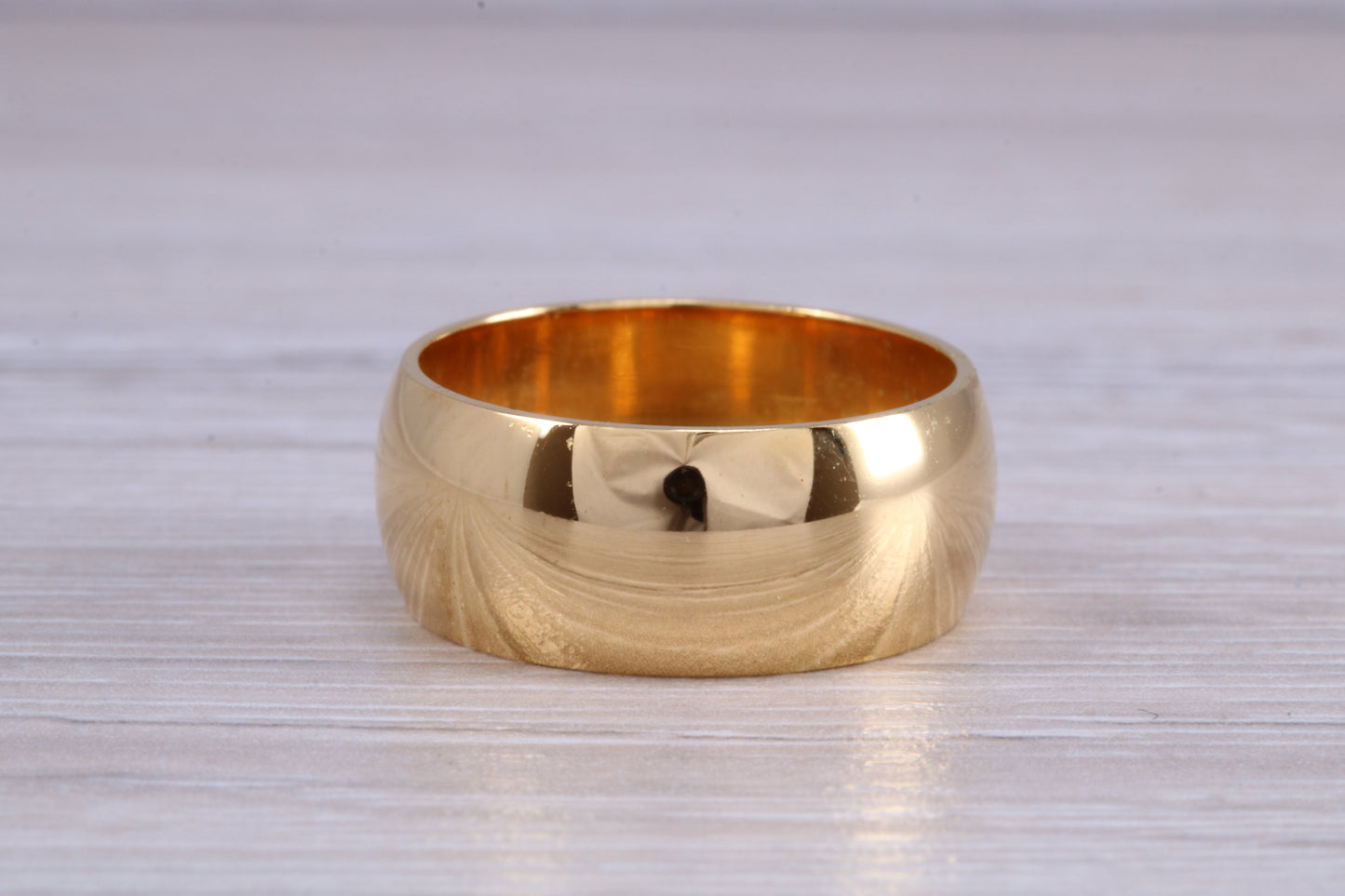 10 mm court profile Silver band with 18ct yellow Gold hard plating, looks just like a gold band for a fraction of the cost. Very wide band