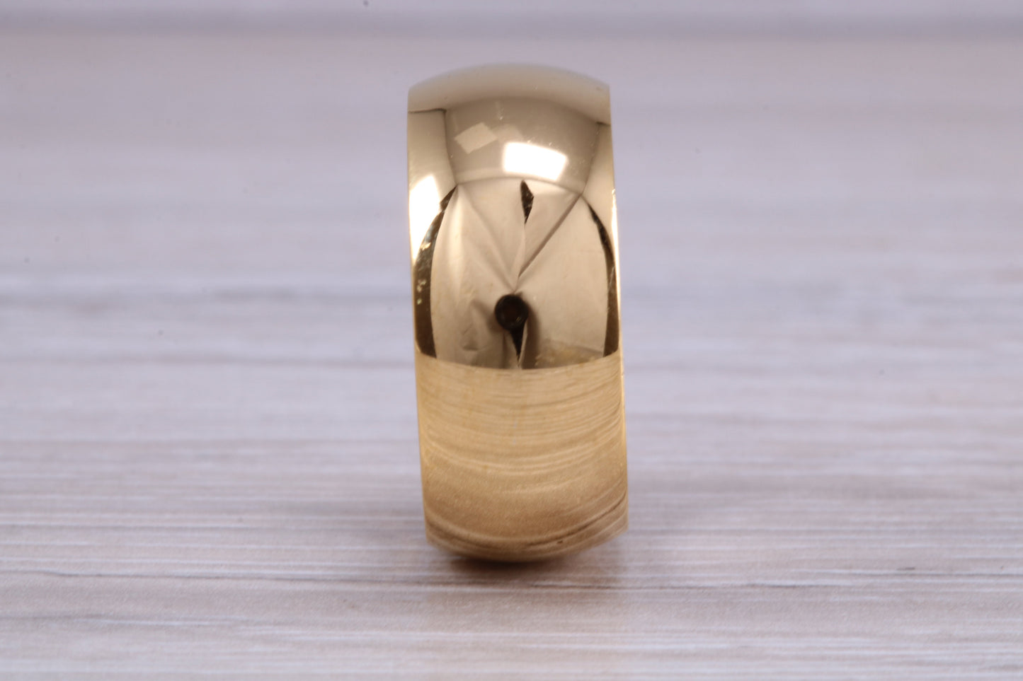 10 mm court profile Silver band with 18ct yellow Gold hard plating, looks just like a gold band for a fraction of the cost. Very wide band