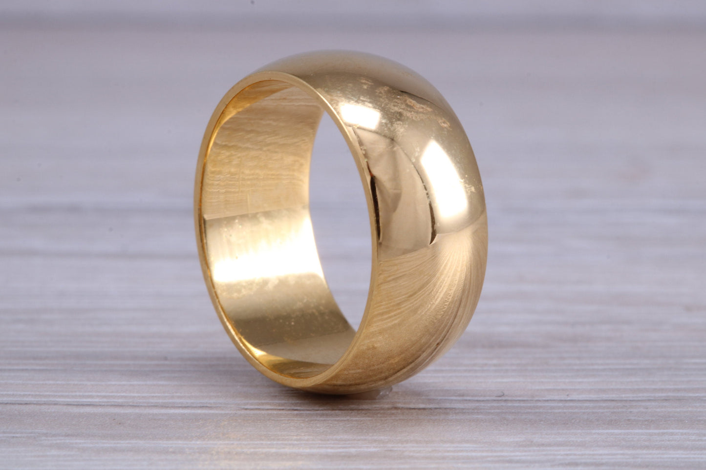 9 mm court profile Silver band with 18ct yellow Gold hard plating, looks just like a gold band for a fraction of the cost. Very wide band
