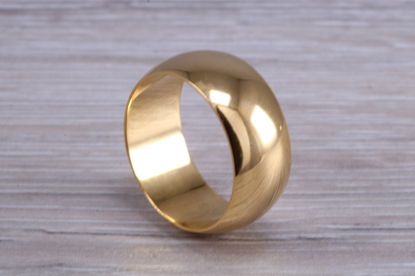 10 mm court profile Silver band with 18ct yellow Gold hard plating, looks just like a gold band for a fraction of the cost. Very wide band