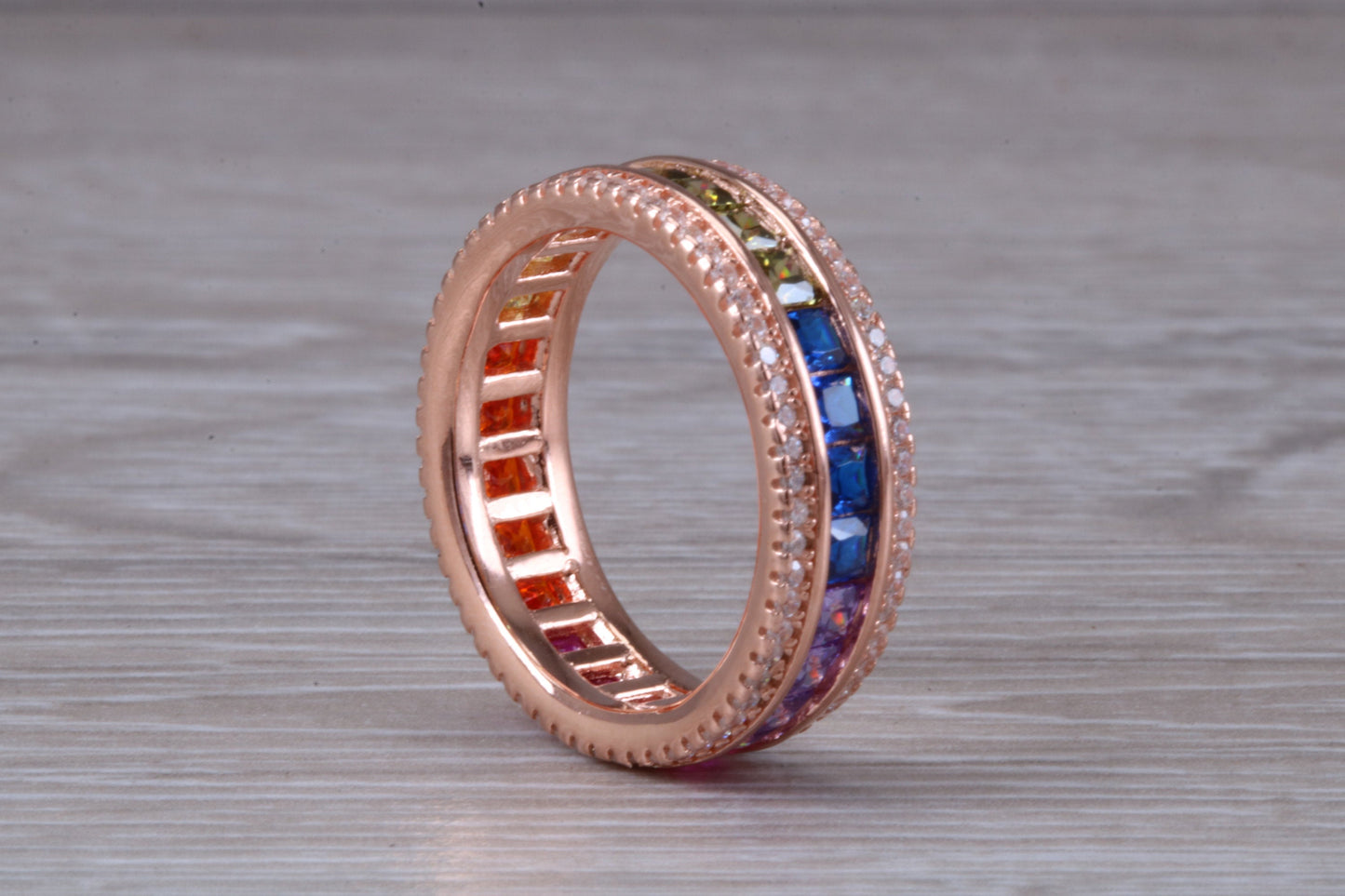 Beautiful fully set rainbow ring, set with top grade multi coloured C Z and 18ct rose gold plated, absolutely stunning ring