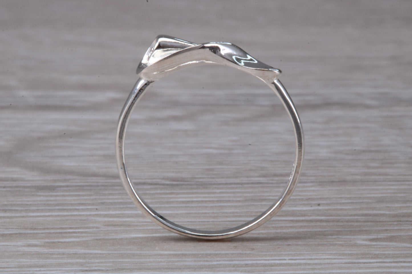 Scroll design ring, solid silver with high polished finish, very dainty and suitable for all ages