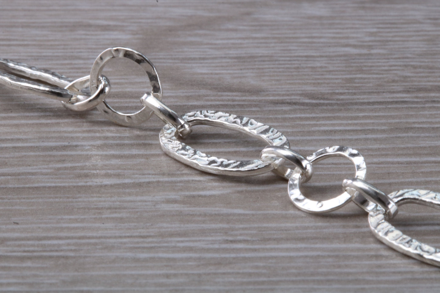 Silver open linked Bracelet with oval and round shaped hammered effect links, light weight and suitable for age groups