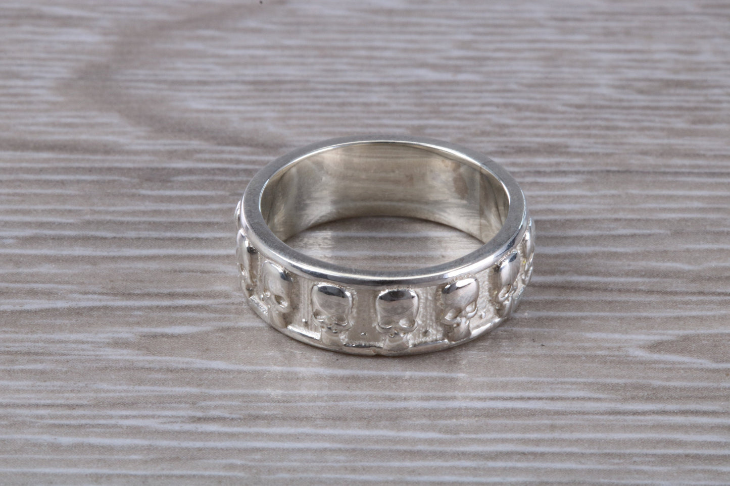 Skull ring,solid sterling silver, small skulls going all around ring, perfect for ladies and gents. Available in other precious metals