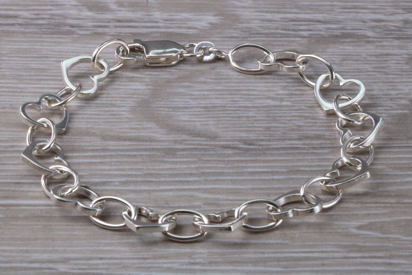Silver open linked Bracelet with oval and heart shaped links, light weight and suitable for age groups