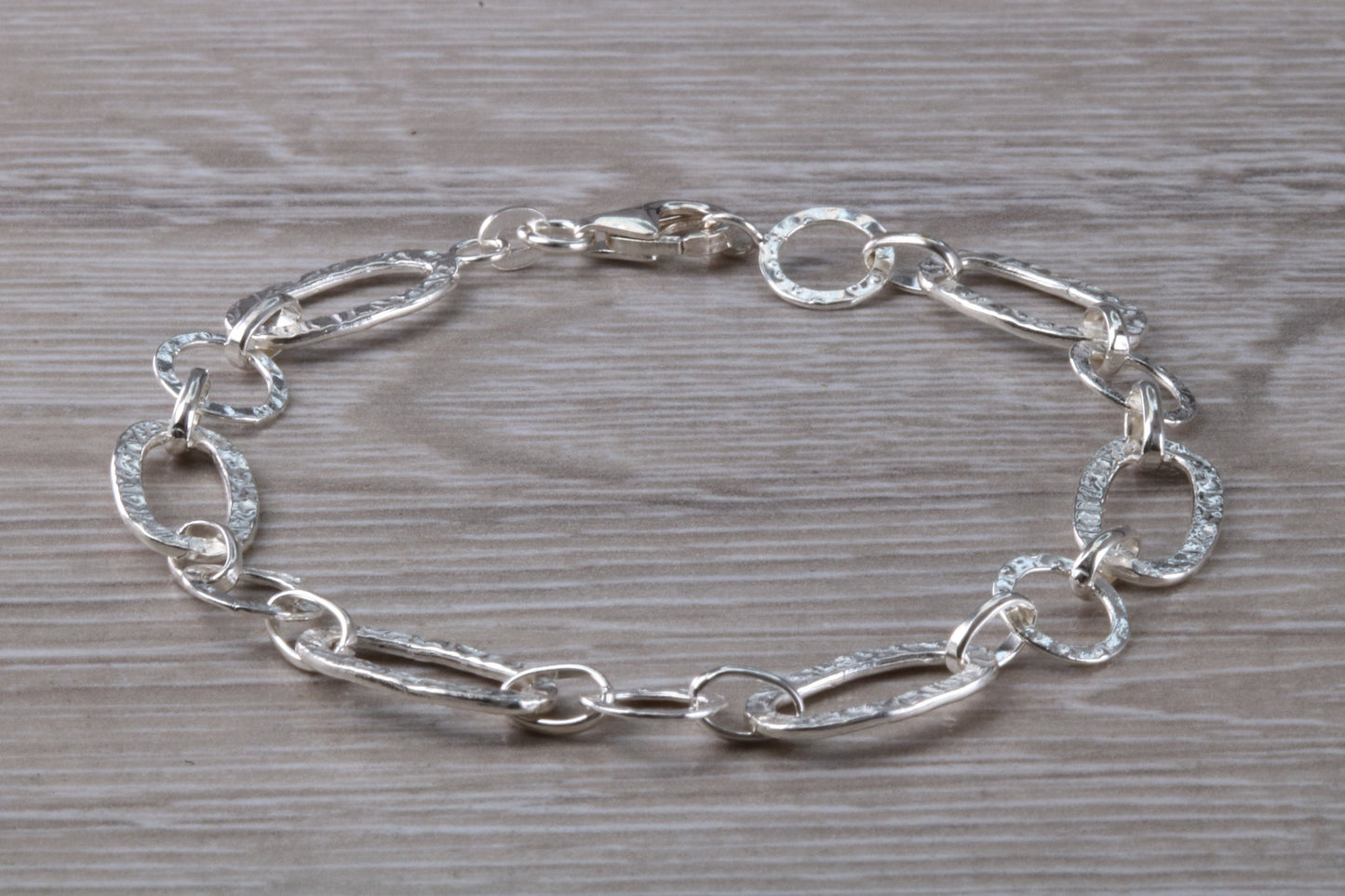 Silver open linked Bracelet with oval and round shaped hammered effect links, light weight and suitable for age groups