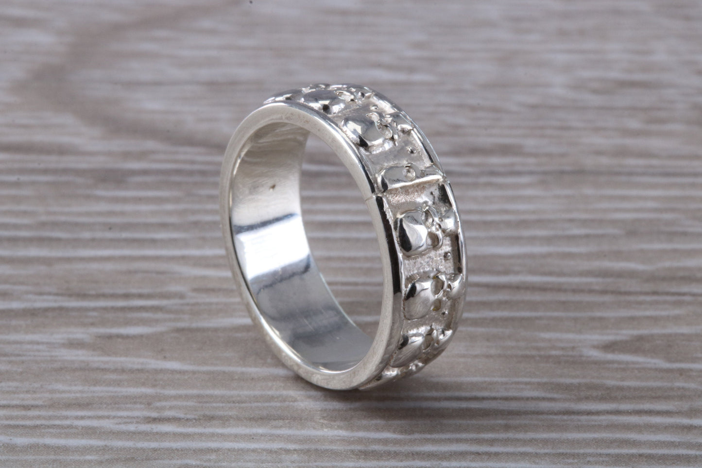Skull ring,solid sterling silver, small skulls going all around ring, perfect for ladies and gents. Available in other precious metals