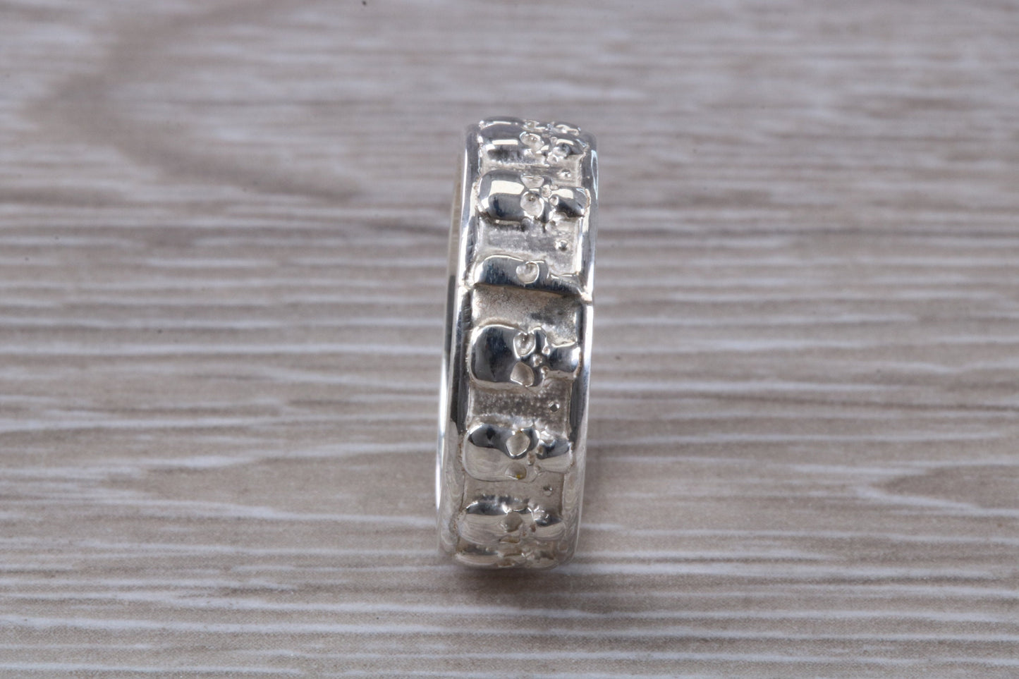 Skull ring,solid sterling silver, small skulls going all around ring, perfect for ladies and gents. Available in other precious metals