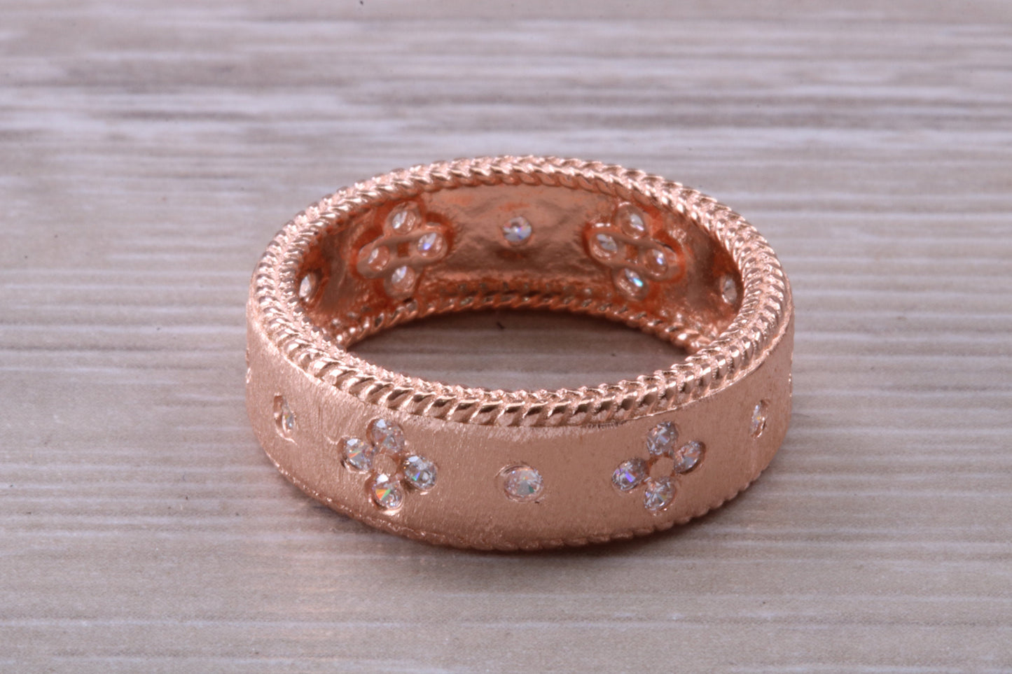 Sterling Silver Rose Gold 7 mm wide band, 18ct Rose Gold plated and set with Diamond White C Z