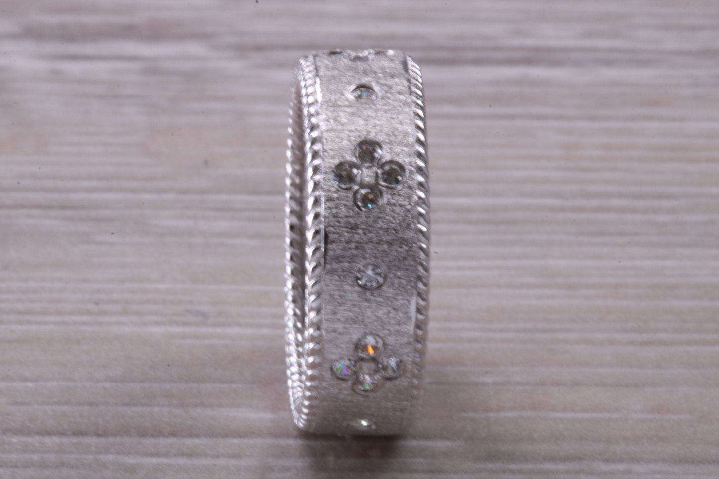 Sterling Silver Gold 7 mm wide band, Rhodium plated and set with Diamond White C Z
