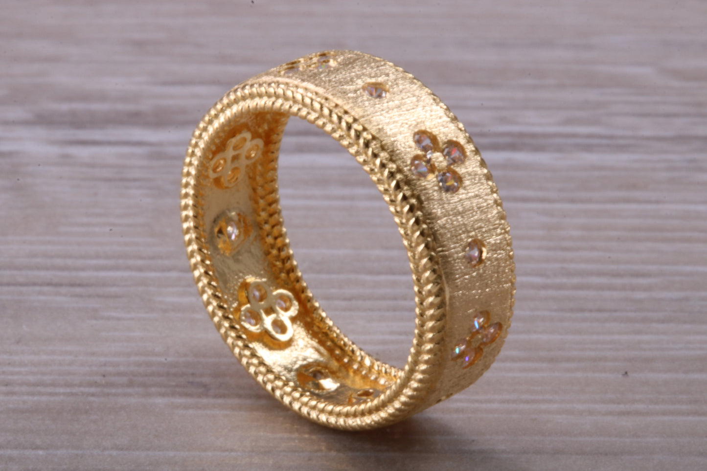 Sterling Silver 7 mm wide band, 18ct Yellow Gold plated and set with Diamond White C Z