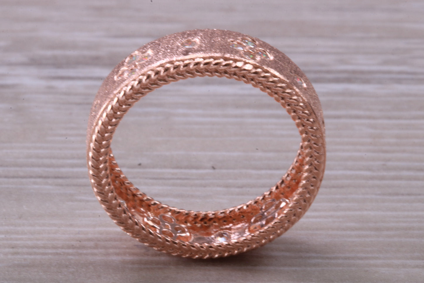 Sterling Silver Rose Gold 7 mm wide band, 18ct Rose Gold plated and set with Diamond White C Z