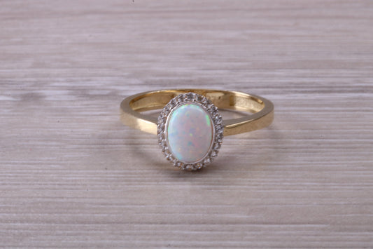 Opal and Diamond White Cubic Zirconia set ring, solid 9ct Yellow Gold, very fiery oval cut Cultured Opal