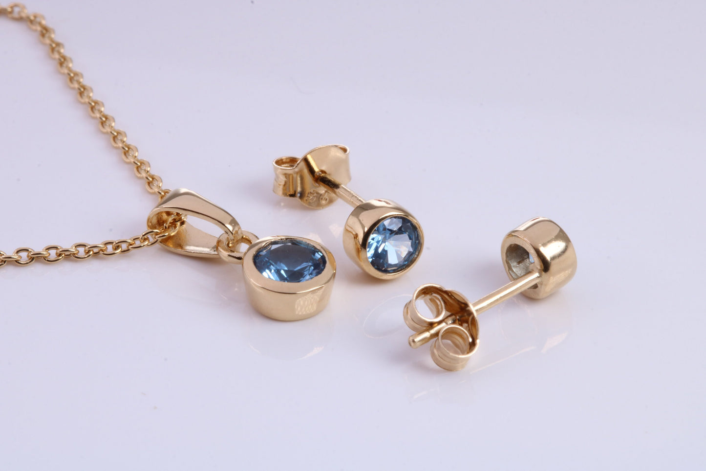 December Blue Zircon C Z set Necklace and Matching Stud Earrings, made from solid Sterling Silver and 18ct Yellow Gold Plated