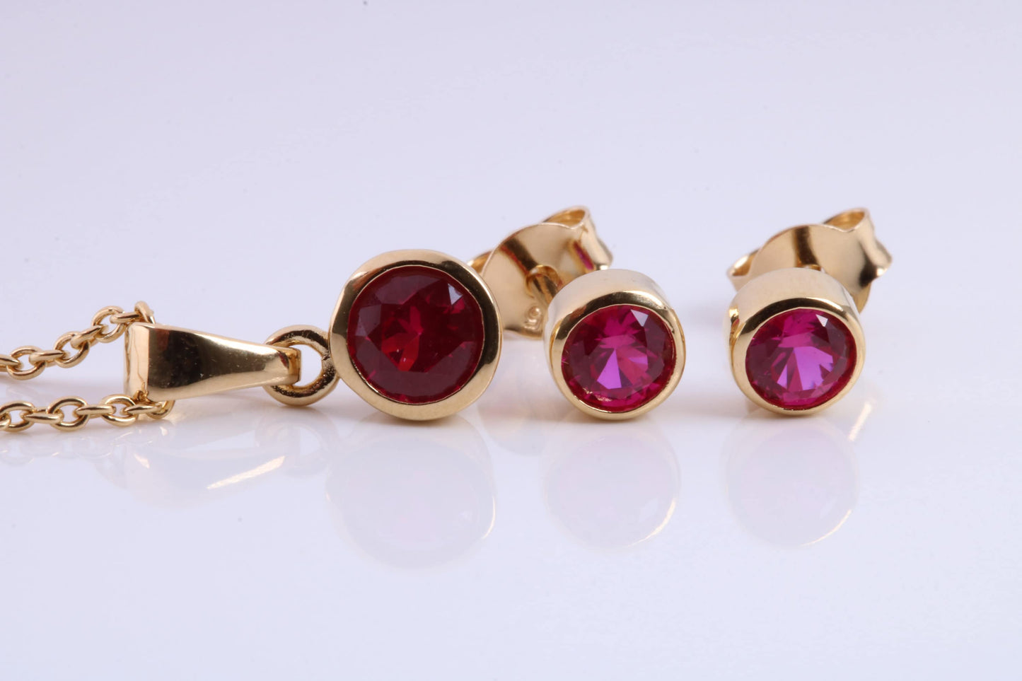 July Ruby C Z set Necklace and Matching Stud Earrings, made from solid Sterling Silver and 18ct Yellow Gold Plated