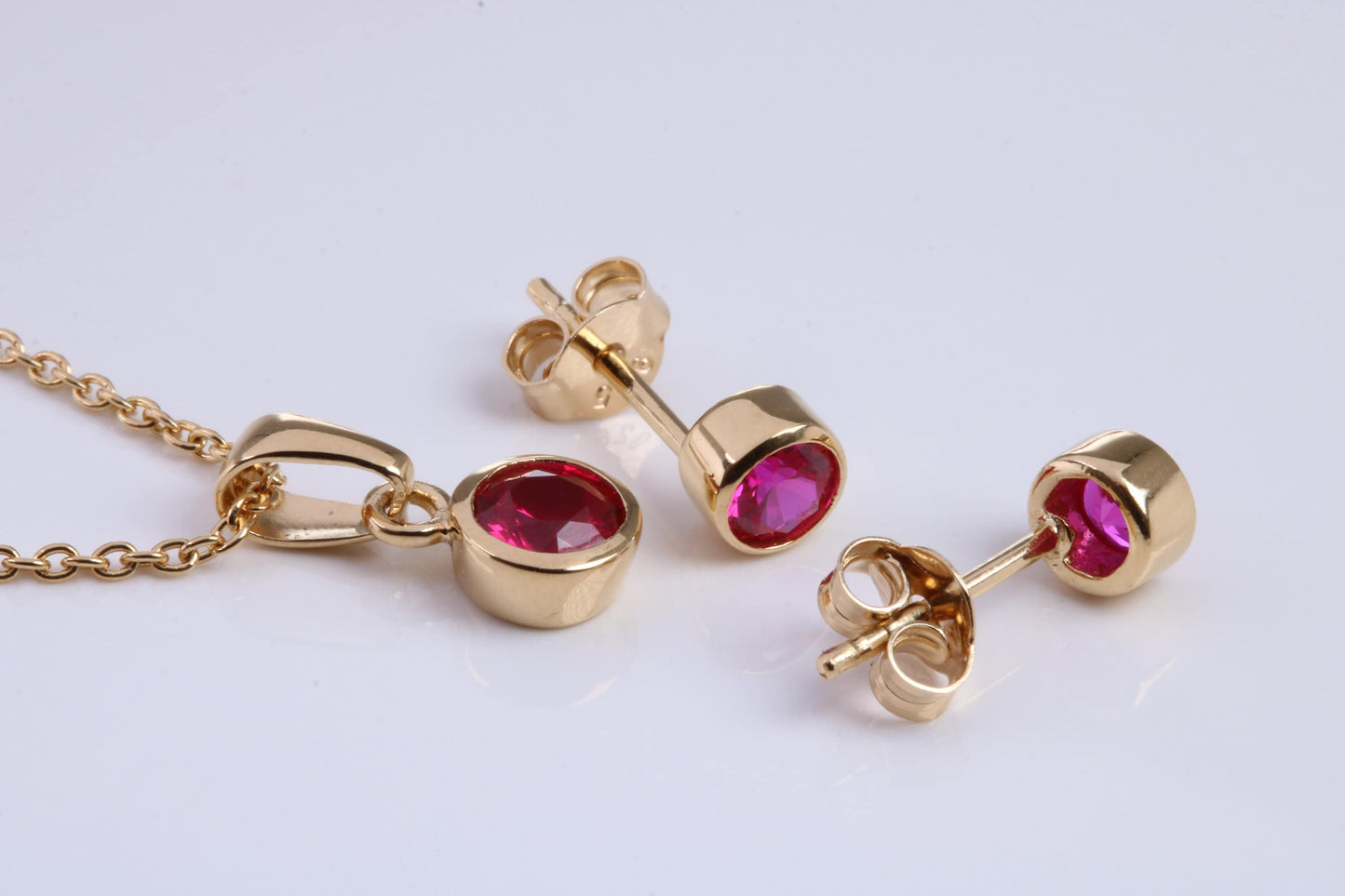 July Ruby C Z set Necklace and Matching Stud Earrings, made from solid Sterling Silver and 18ct Yellow Gold Plated