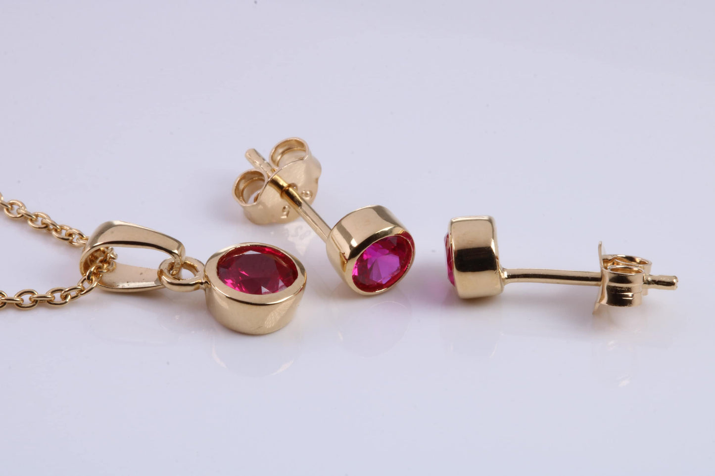 July Ruby C Z set Necklace and Matching Stud Earrings, made from solid Sterling Silver and 18ct Yellow Gold Plated