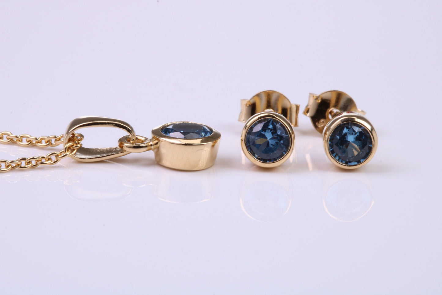 December Blue Zircon C Z set Necklace and Matching Stud Earrings, made from solid Sterling Silver and 18ct Yellow Gold Plated