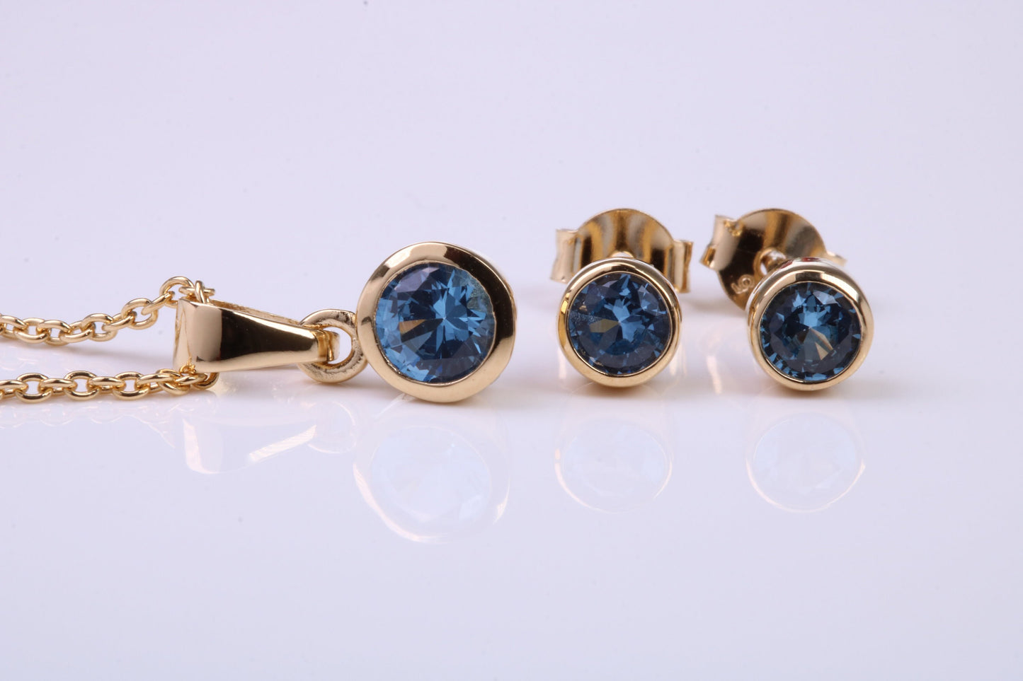 December Blue Zircon C Z set Necklace and Matching Stud Earrings, made from solid Sterling Silver and 18ct Yellow Gold Plated
