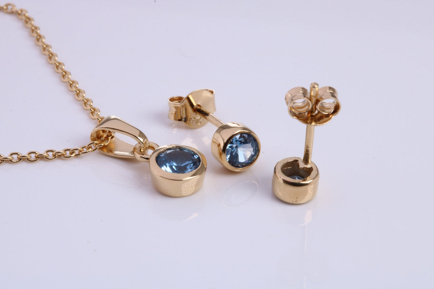 December Blue Zircon C Z set Necklace and Matching Stud Earrings, made from solid Sterling Silver and 18ct Yellow Gold Plated