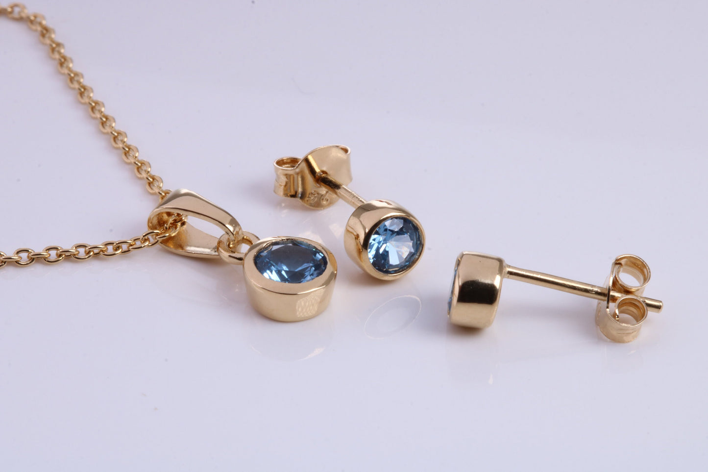December Blue Zircon C Z set Necklace and Matching Stud Earrings, made from solid Sterling Silver and 18ct Yellow Gold Plated