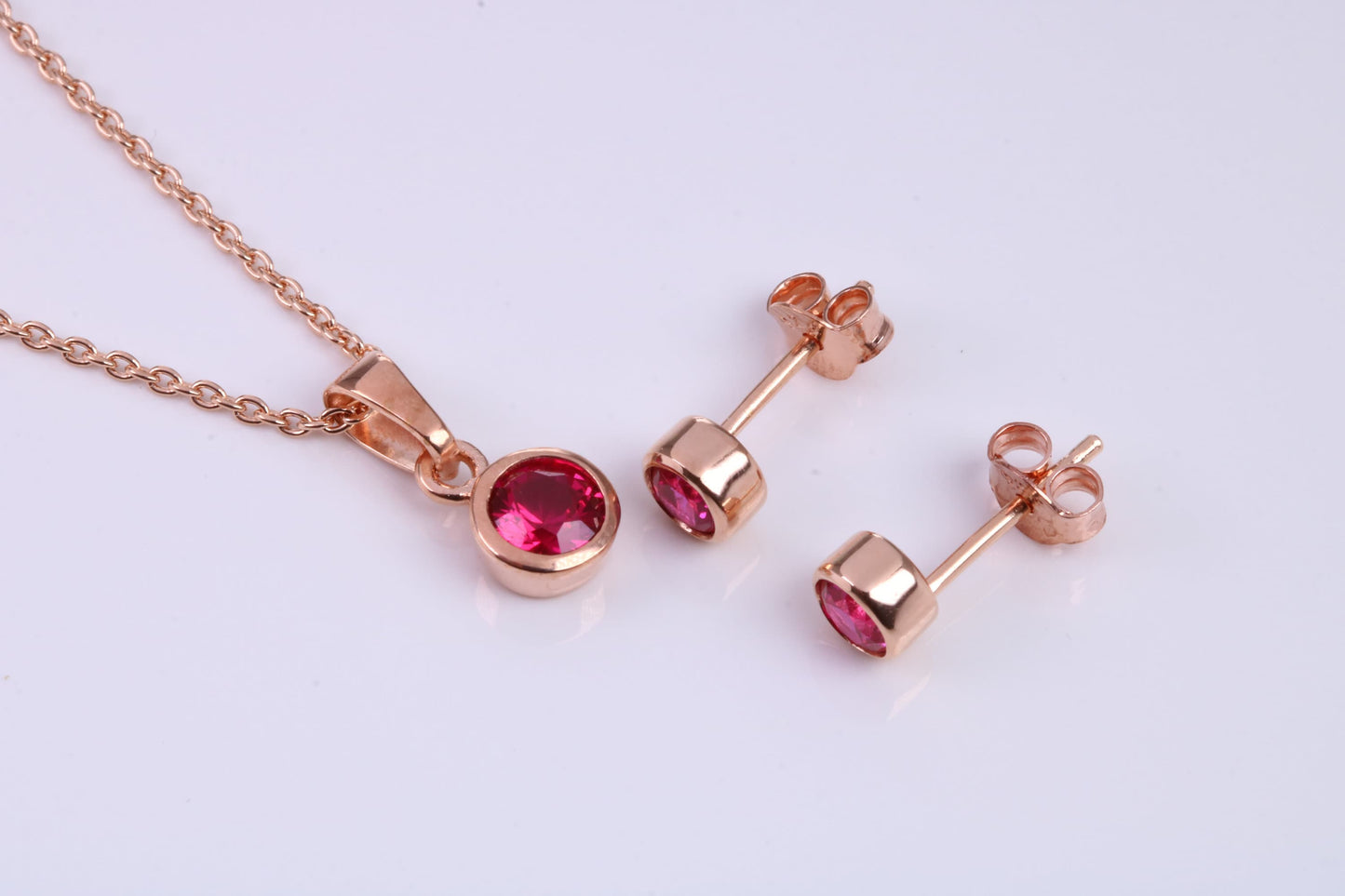 July Ruby C Z set Necklace and Matching Stud Earrings, made from solid Sterling Silver and 18ct Rose Gold Plated