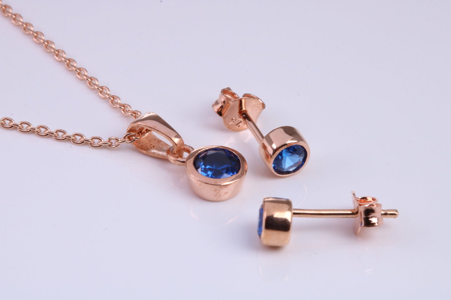 September Blue Sapphire C Z set Necklace and Matching Stud Earrings, made from solid Sterling Silver and 18ct Rose Gold Plated