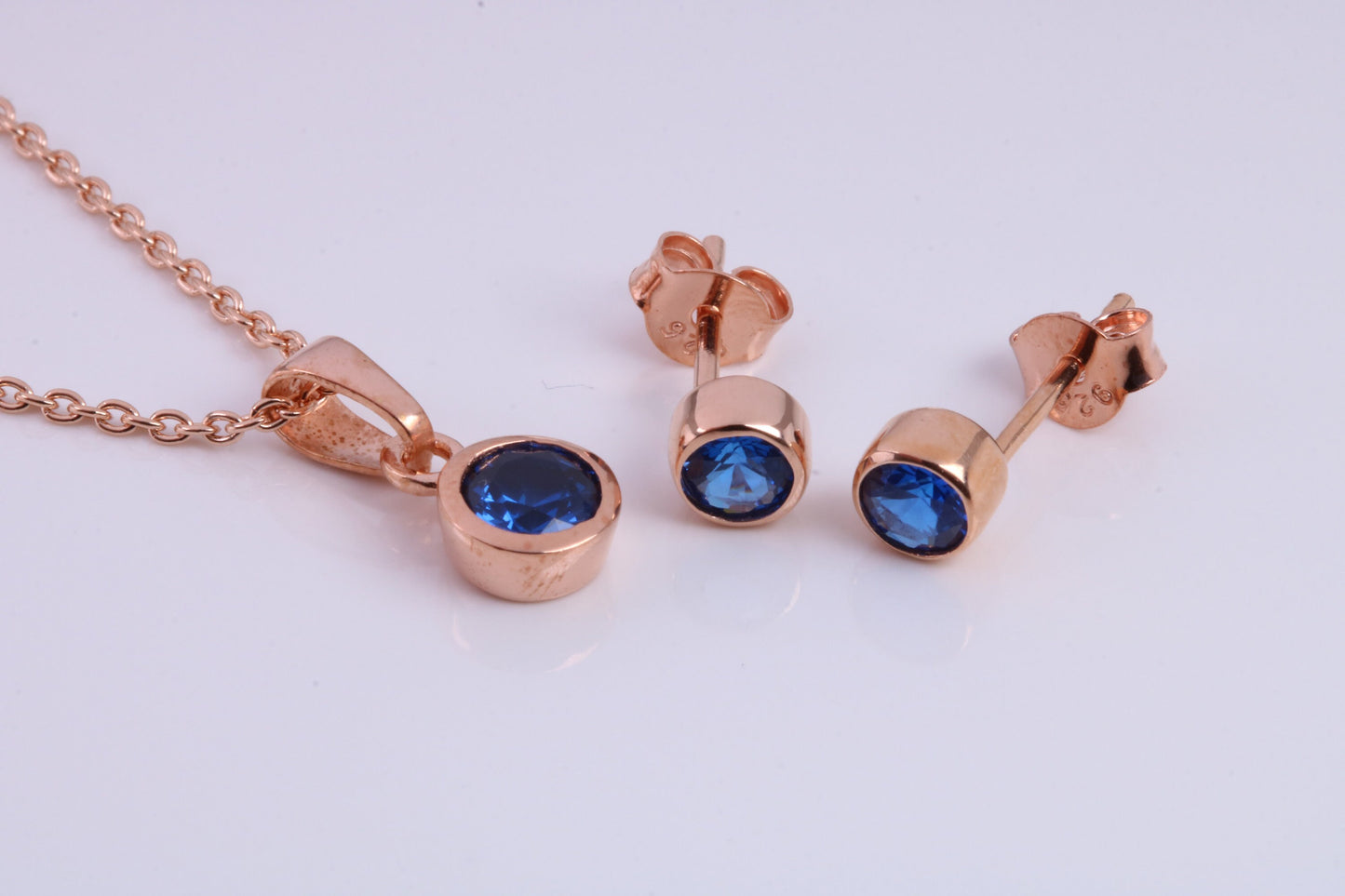 September Blue Sapphire C Z set Necklace and Matching Stud Earrings, made from solid Sterling Silver and 18ct Rose Gold Plated