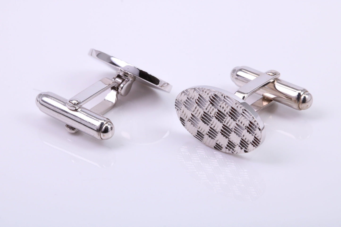 Machine Patterned Oval Shaped Solid Silver Cufflinks
