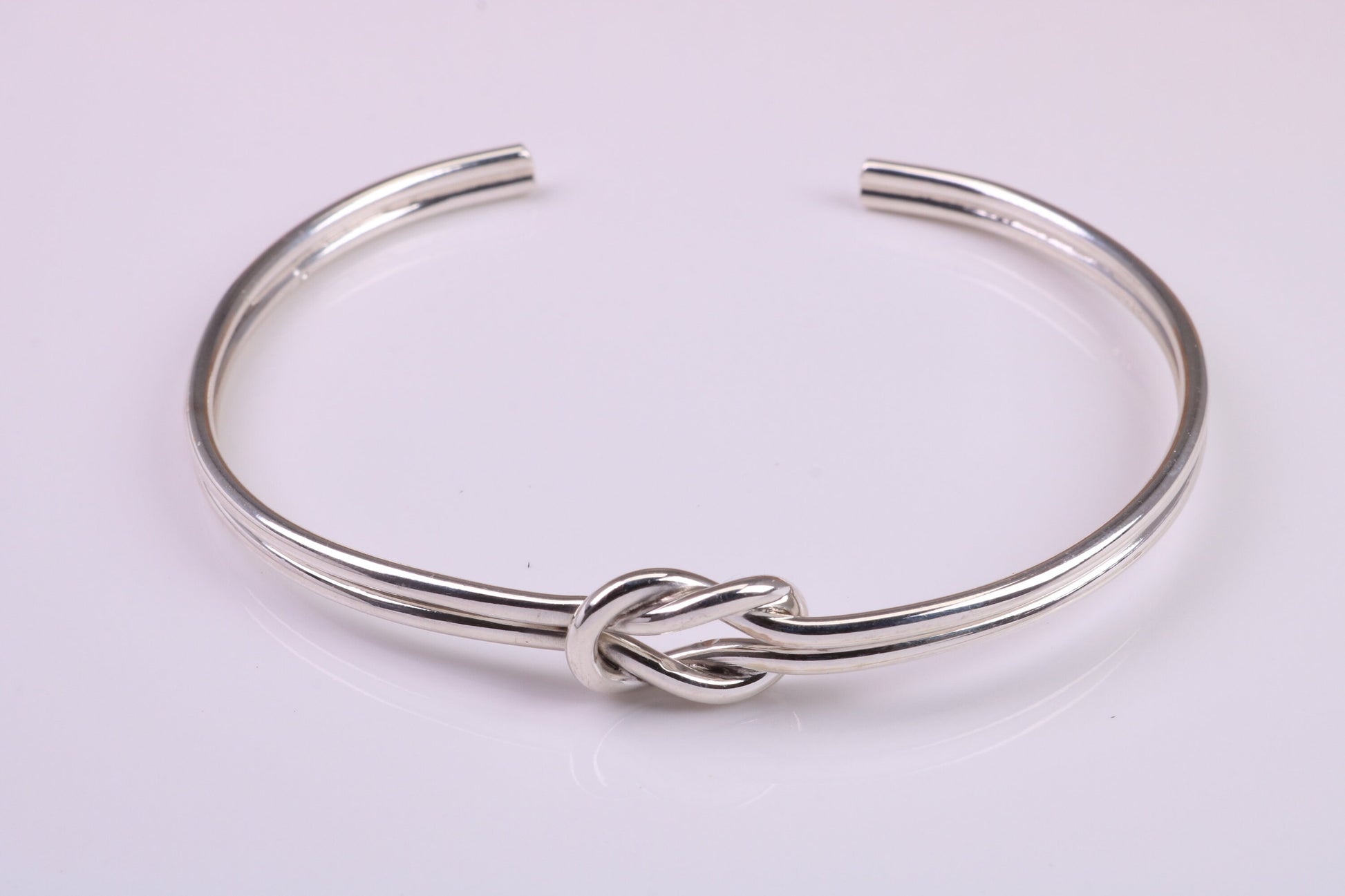 Knotted Open End Oval Solid Silver Bangle