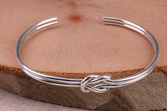 Knotted Open End Oval Solid Silver Bangle