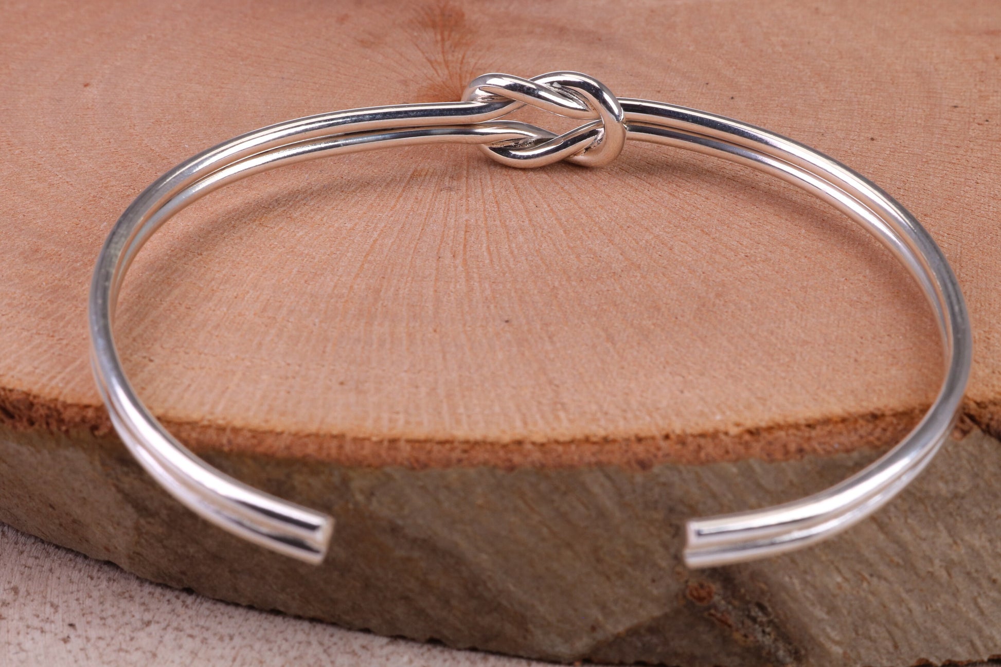 Knotted Open End Oval Solid Silver Bangle