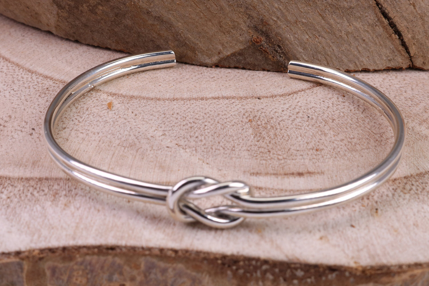 Knotted Open End Oval Solid Silver Bangle