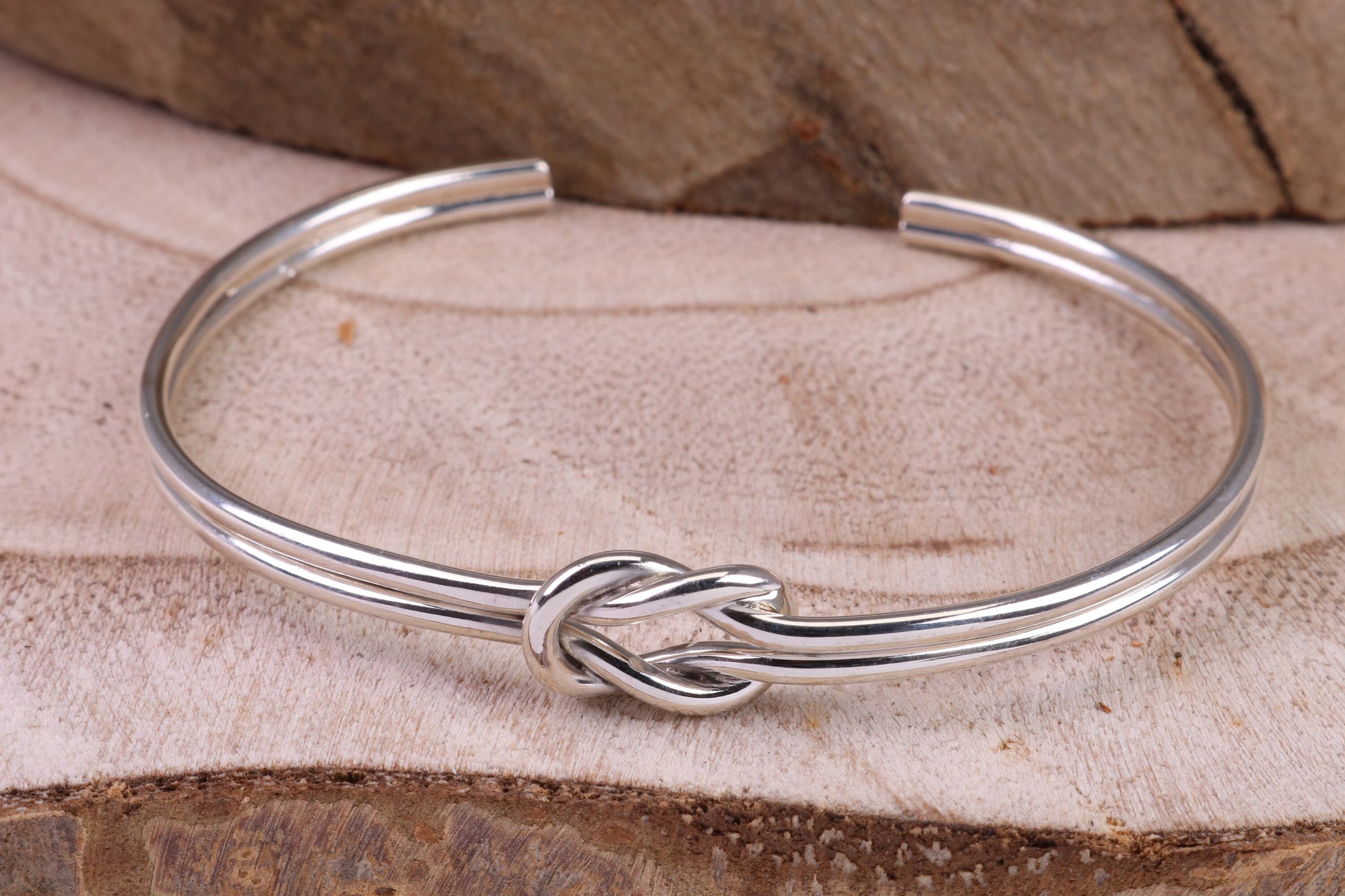 Knotted Open End Oval Solid Silver Bangle