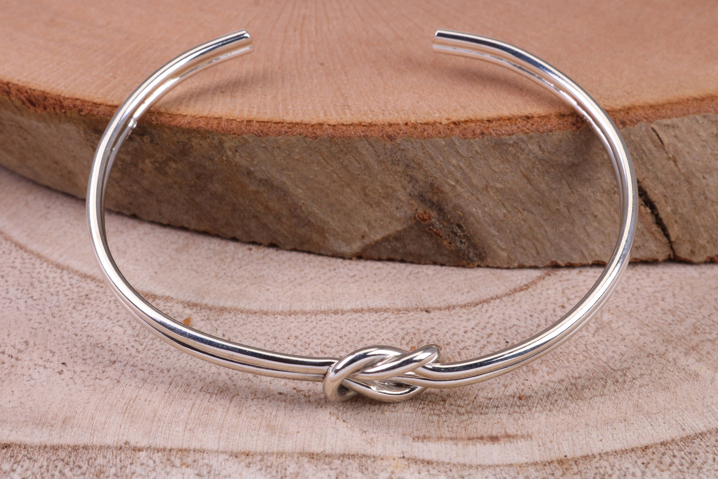 Knotted Open End Oval Solid Silver Bangle