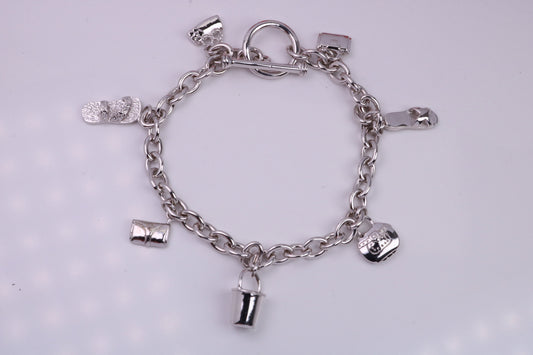 Ready to Wear Charms Bracelet, With Seven C Z set Charms Attached, Made from solid Sterling Silver, 7.50 Inches Long, Good Weighty Feel