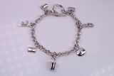 Ready to Wear Charms Bracelet, With Seven C Z set Charms Attached, Made from solid Sterling Silver, 7.50 Inches Long, Good Weighty Feel