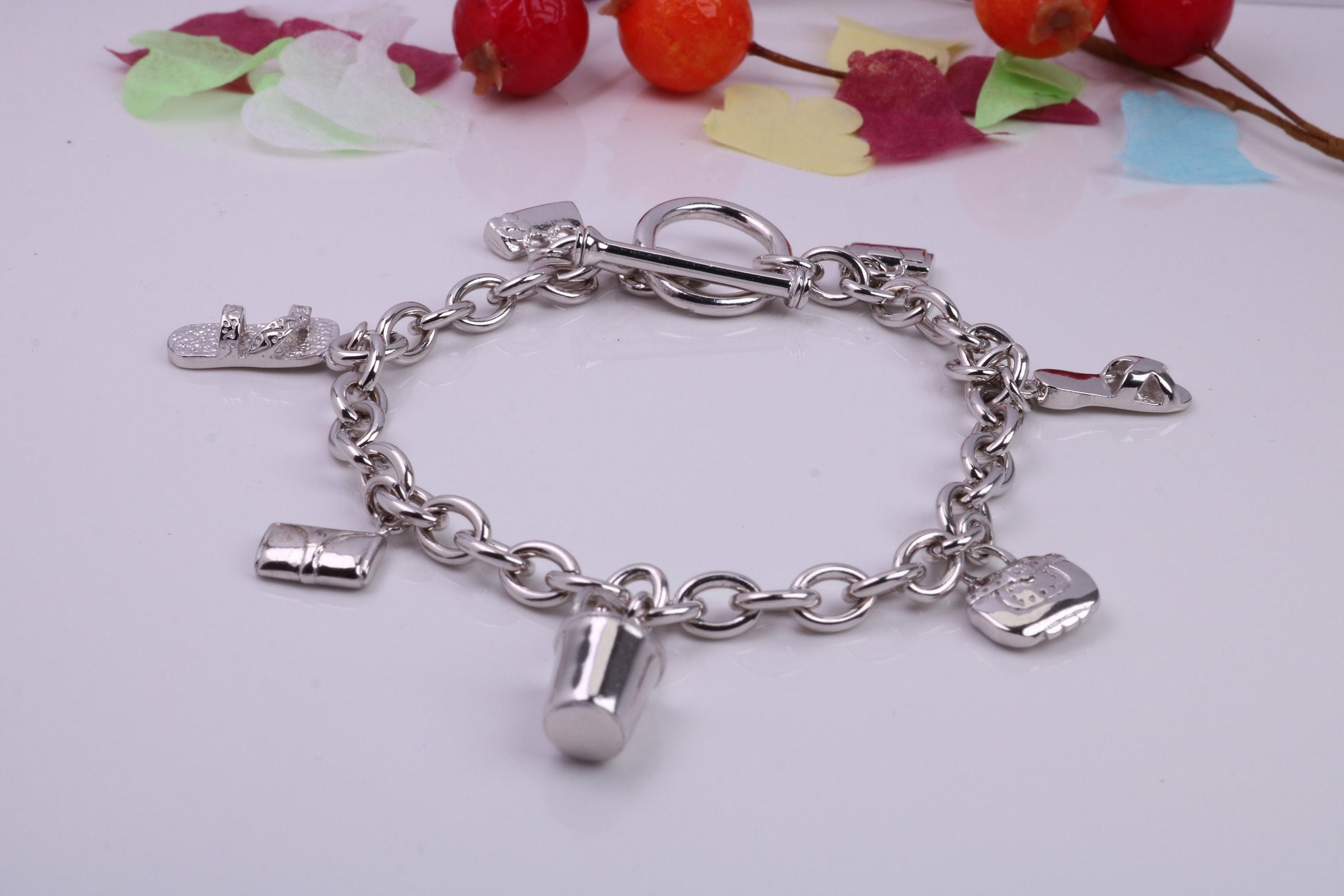Ready to Wear Charms Bracelet, With Seven C Z set Charms Attached, Made from solid Sterling Silver, 7.50 Inches Long, Good Weighty Feel