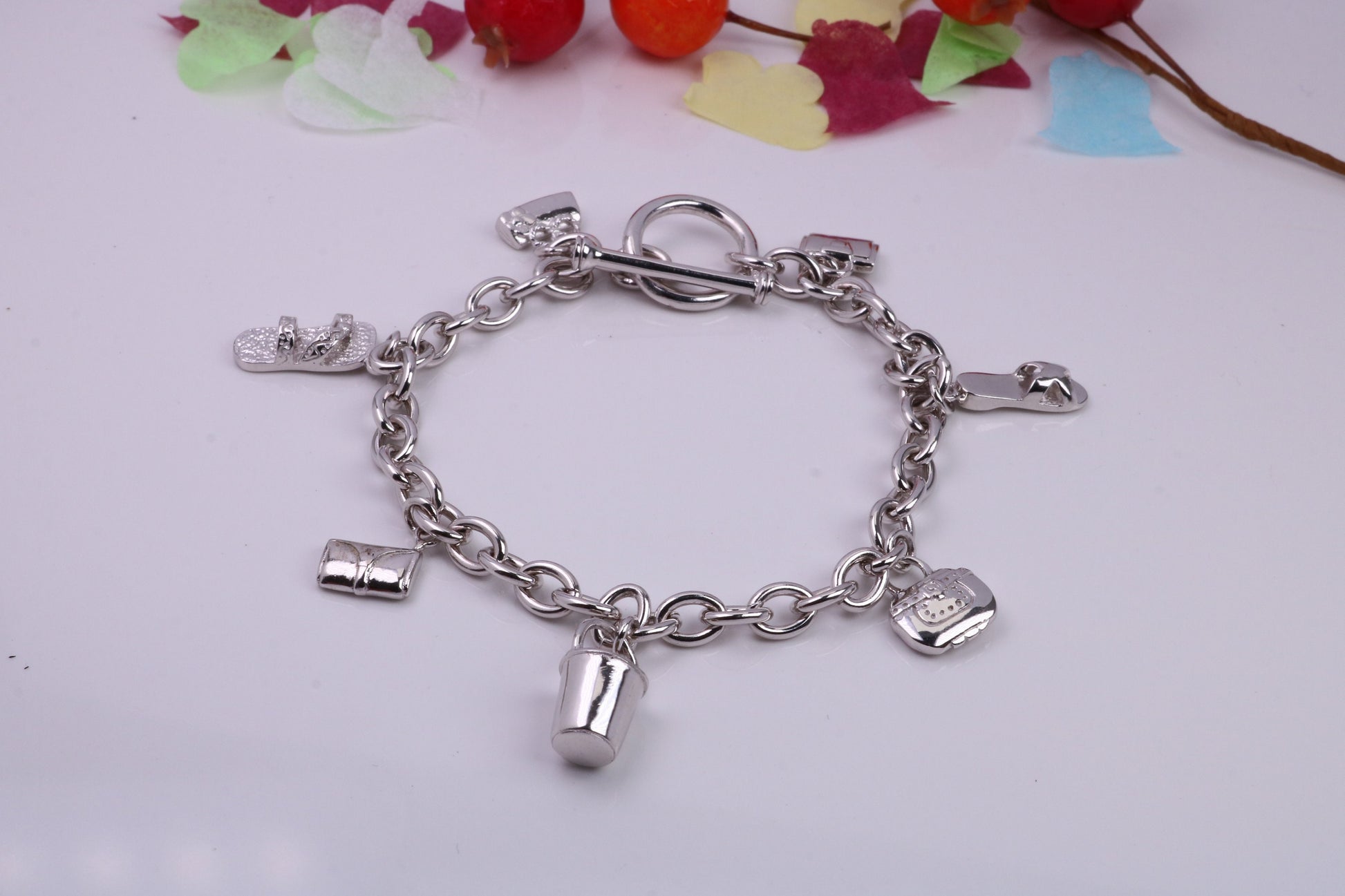 Ready to Wear Charms Bracelet, With Seven C Z set Charms Attached, Made from solid Sterling Silver, 7.50 Inches Long, Good Weighty Feel