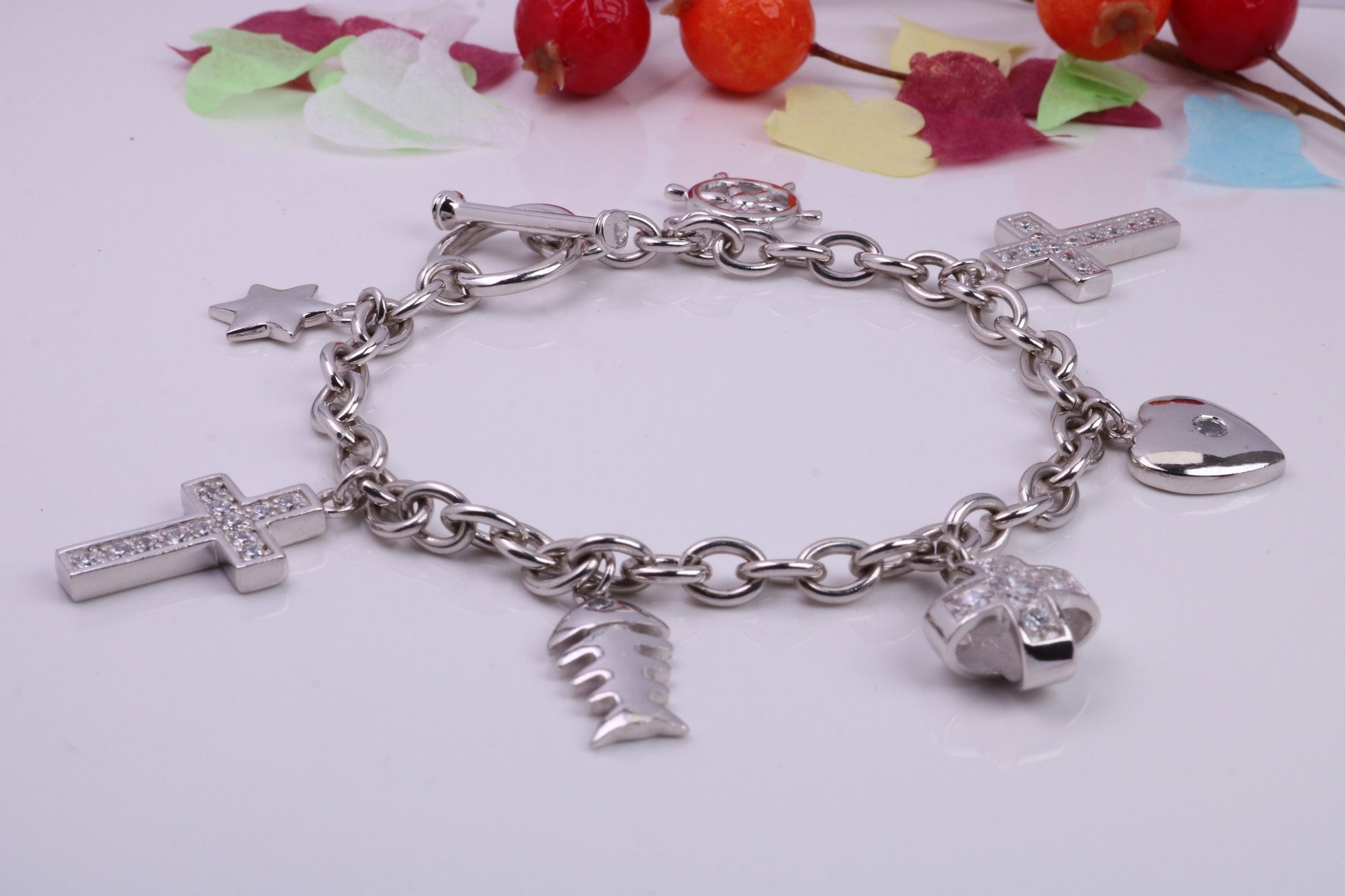 Ready to Wear Charms Bracelet, With Seven C Z set Charms Attached, Made from solid Sterling Silver, 7.50 Inches Long, Good Weighty Feel