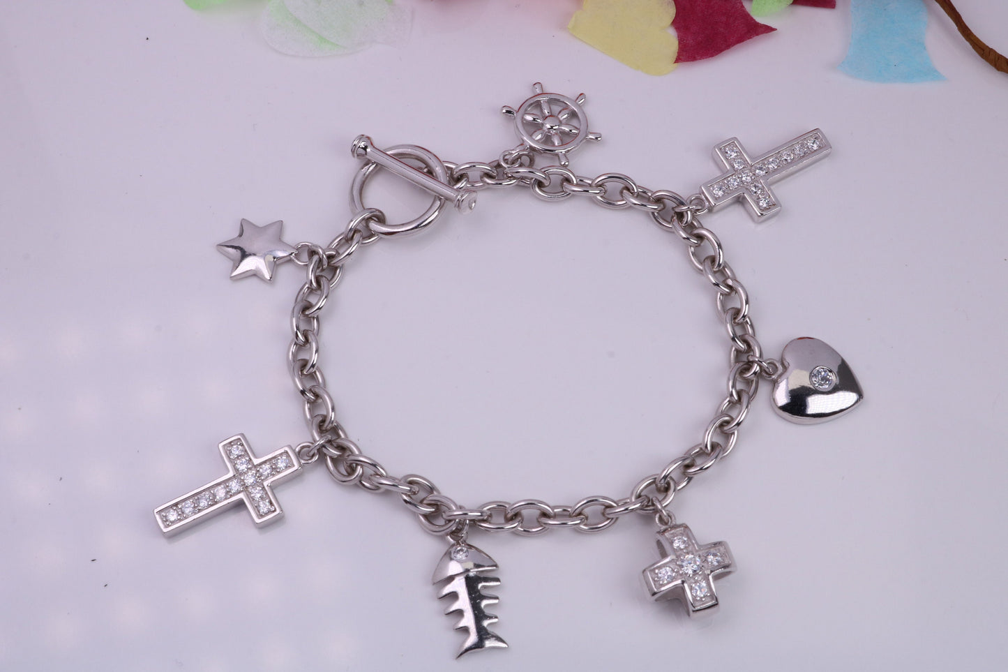 Ready to Wear Charms Bracelet, With Seven C Z set Charms Attached, Made from solid Sterling Silver, 7.50 Inches Long, Good Weighty Feel