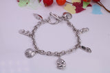 Ready to Wear Charms Bracelet, With Seven Charms Attached, Made from solid Sterling Silver, 7.50 Inches Long, Good Weighty Feel