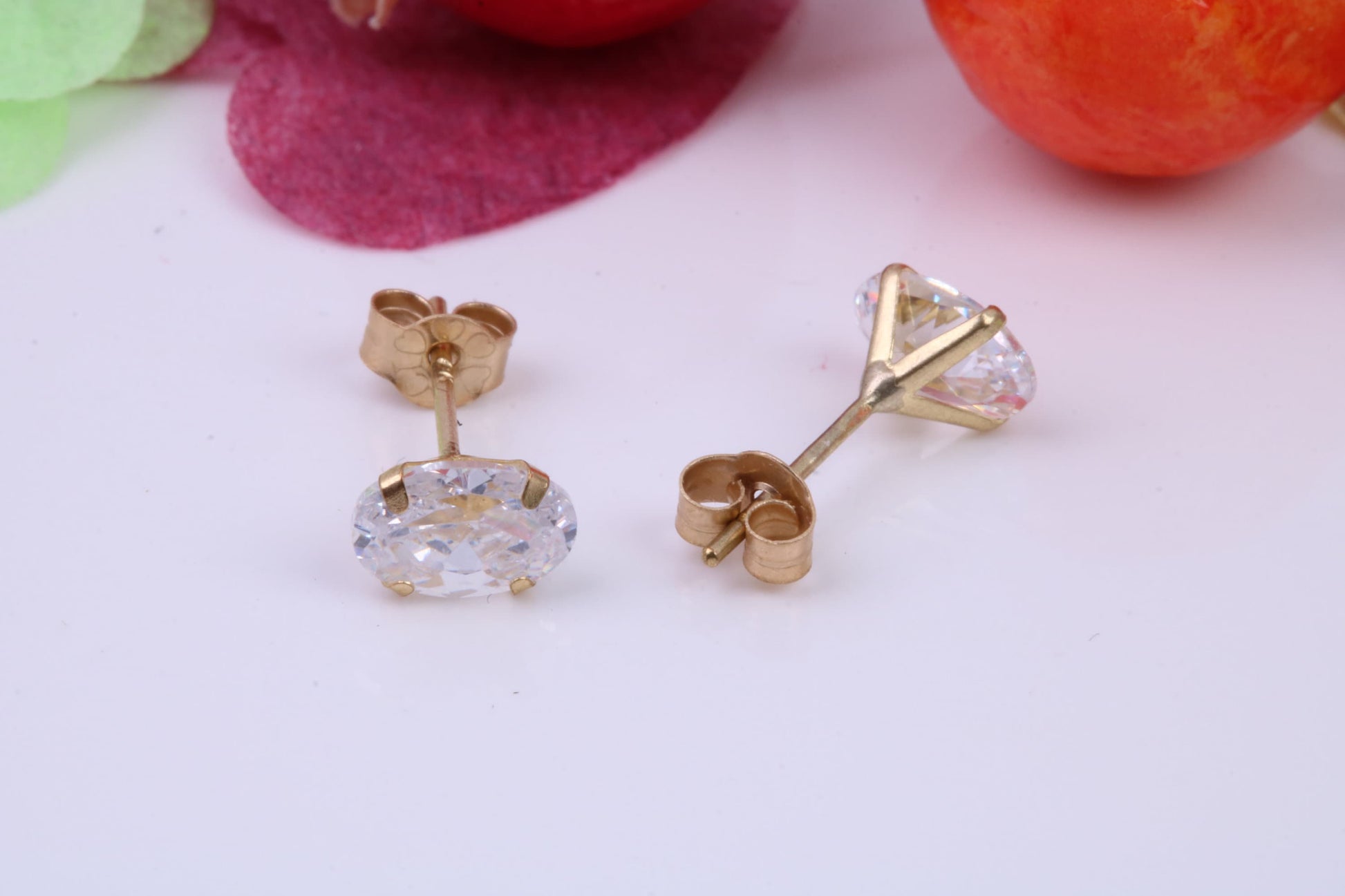 Oval cut Cubic Zirconia set Stud Earrings, Measures 6 x 4 mm, Made from Solid 9ct Yellow Gold
