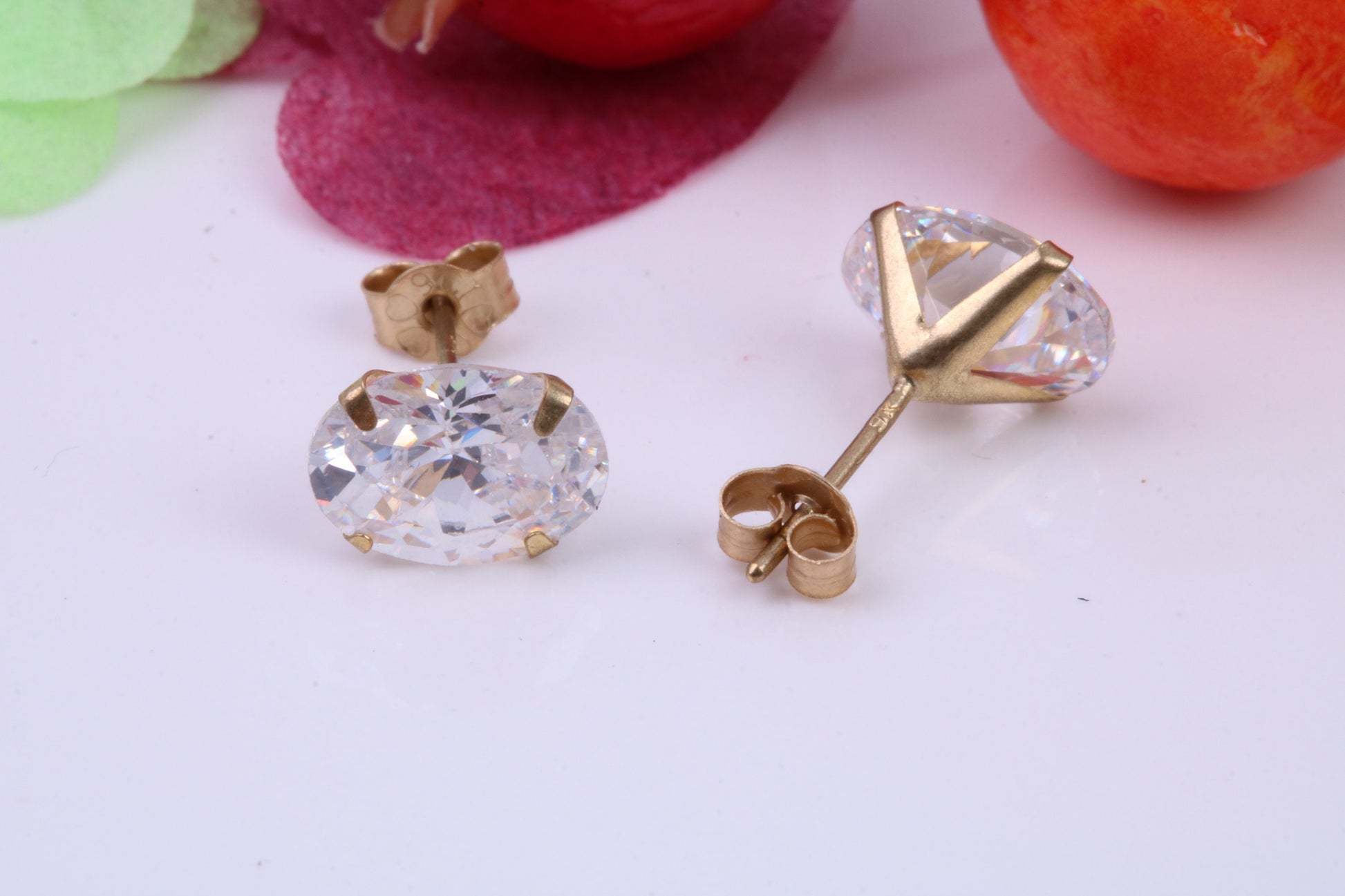 Oval cut Cubic Zirconia set Stud Earrings, Measures 7 x 5 mm, Made from Solid 9ct Yellow Gold