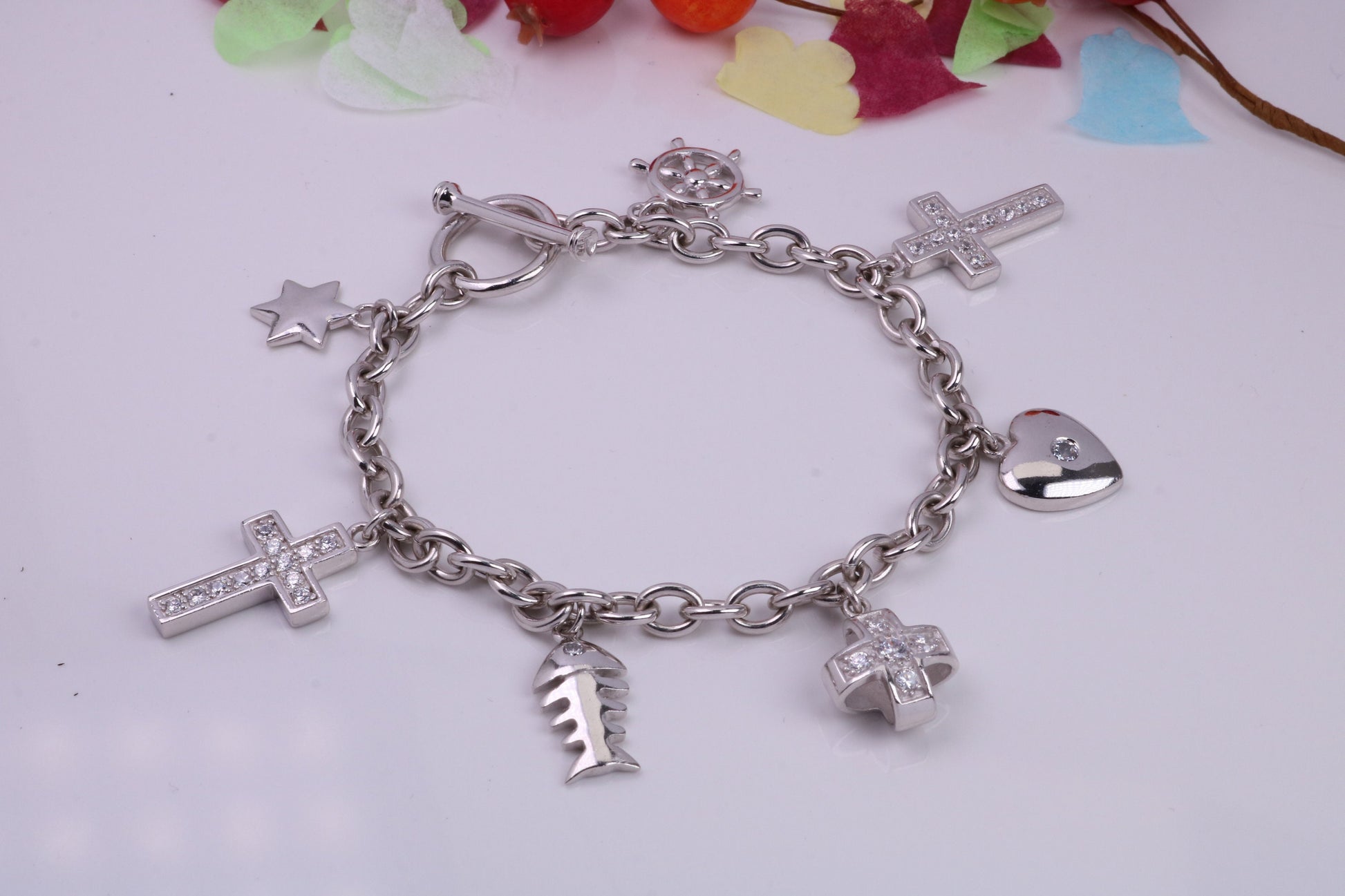 Ready to Wear Charms Bracelet, With Seven C Z set Charms Attached, Made from solid Sterling Silver, 7.50 Inches Long, Good Weighty Feel