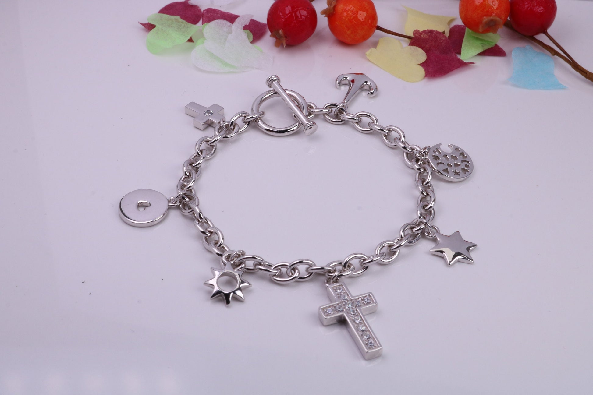 Ready to Wear Charms Bracelet, With Seven C Z set Charms Attached, Made from solid Sterling Silver, 7.50 Inches Long, Good Weighty Feel