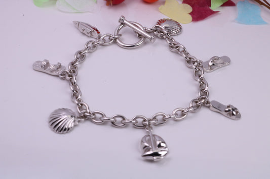 Ready to Wear Charms Bracelet, With Seven Charms Attached, Made from solid Sterling Silver, 7.50 Inches Long, Good Weighty Feel