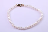 Simple 4 mm Round Natural Freshwater Pearl Bracelet set in Solid Yellow Gold