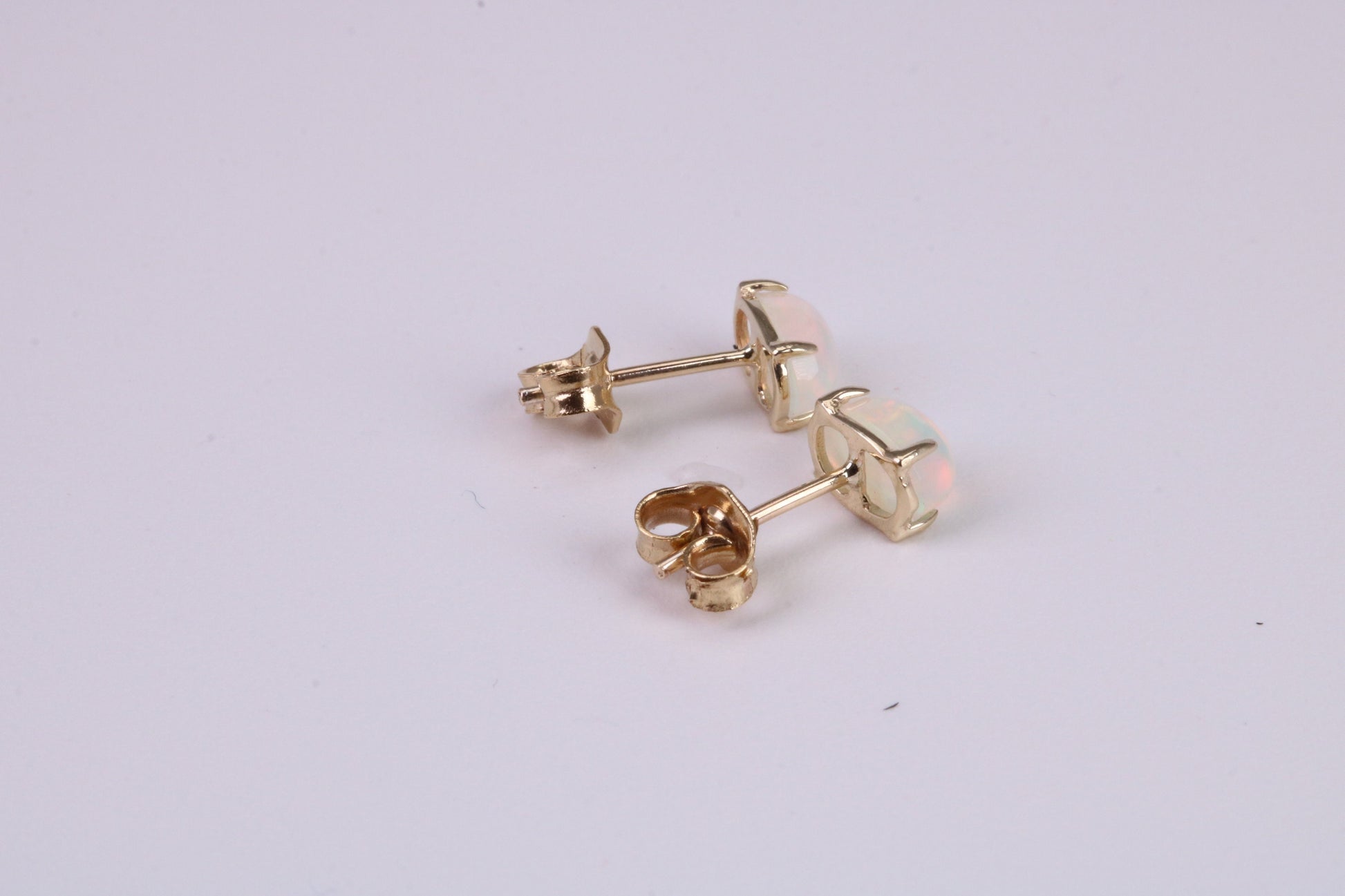 Natural Oval cut Opal set Stud Earrings Made from Solid Yellow Gold